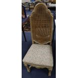A set of four caned high back dining chairs