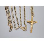 A 9ct gold crucifix on a 9ct chain(66cm) and a 9k oval link chain (a.f), 14.8g.CONDITION: A.F. chain
