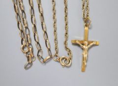 A 9ct gold crucifix on a 9ct chain(66cm) and a 9k oval link chain (a.f), 14.8g.CONDITION: A.F. chain