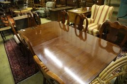 A reproduction mahogany twin pillar extending dining table and eight George I style chairs, 300cm