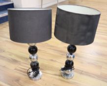 A pair of modern chrome and black painted table lamps, with black shades, height approx. 63cm