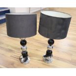 A pair of modern chrome and black painted table lamps, with black shades, height approx. 63cm