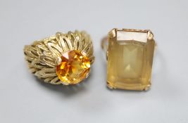 Two 9ct and citrine set dress rings, size L, gross 16.4 grams.CONDITION: Both showing signs of