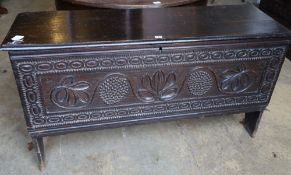 A 16th / 17th century boarded oak chest, width 134cm depth 43cm height 74cm