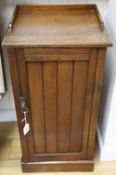 A late Victorian Aesthetic movement walnut bedside cabinet, width 39cm depth 36cm height 76cm