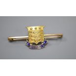 An early 20th century 15ct and enamel 'Army Ordnance Department' bar brooch, 47mm, gross 4.8 grams.