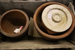 A terracotta bread crock and two others, largest diameter 40cm