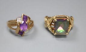 A 9ct gold and tourmaline? dress ring with fancy mount, size L/M and a 9ct gold, amethyst and