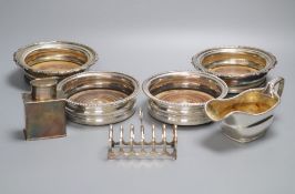 Two pairs of silver plated wine coasters, a plated toastrack, tea daddy and cream jugCONDITION: