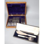 A cased pair of plated bone handled fish servers and a set of five (ex 6) mother o'pearl handled