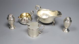 A Victorian silver cream jug, London, 1860, a later silver mustard, sauceboat and pair of