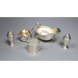 A Victorian silver cream jug, London, 1860, a later silver mustard, sauceboat and pair of