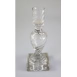A George III rib moulded glass candlestick, third quarter 18th century, with hollow stem and '