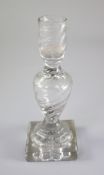 A George III rib moulded glass candlestick, third quarter 18th century, with hollow stem and '
