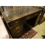 A military style mahogany and brass bound twin pedestal desk, width 137cm depth 69cm height 77cm