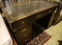 A military style mahogany and brass bound twin pedestal desk, width 137cm depth 69cm height 77cm