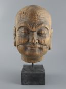 A Chinese jichimu head of luohan, Song dynasty or later, total height including plinth, 31cm