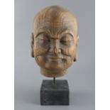 A Chinese jichimu head of luohan, Song dynasty or later, total height including plinth, 31cm