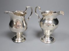 A late George II silver inverted pear shaped cream jug, Stamp & Baker, London, 1759, 10cm and one