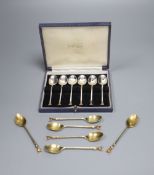 A set of six 1970's silver gilt 'fox head' terminal coffee spoons, 77 grams and a plated set of