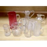 Nine various 19/20th century glass jugs, including a ruby crackle glass jug, tallest 25.