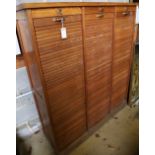 An oak triple tambour filing cabinet, width 128cm depth 39cm height 148cm