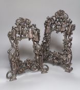 A pair of bronze patinated metal figural photograph frames, height 38cm