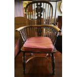 A 19th century Windsor elm and ash stick back elbow chair