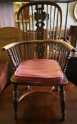 A 19th century Windsor elm and ash stick back elbow chair