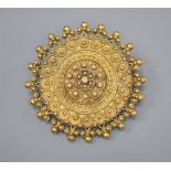 A late Victorian yellow metal circular brooch, with sphere and ropetwist decoration, 28mm, 7.7