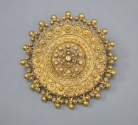 A late Victorian yellow metal circular brooch, with sphere and ropetwist decoration, 28mm, 7.7