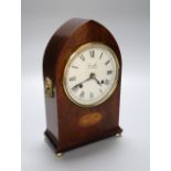 An inlaid mahogany lancet shaped mantel timepiece, retailed by Comitti, London, height 27cm (