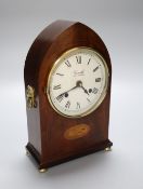 An inlaid mahogany lancet shaped mantel timepiece, retailed by Comitti, London, height 27cm (