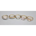Five assorted modern 14ct gold and CZ set dress rings, gross 13 grams.