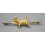 An early 20th century yellow metal, 18ct and rose cut diamond set terrier bar brooch, 63mm, gross