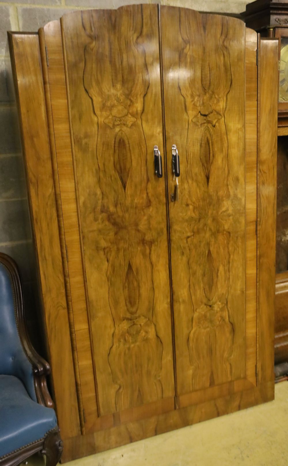 An Art Deco figured walnut wardrobe, width 114cm depth 48cm height 192cm