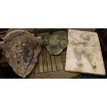 A plaster cherub plaque, a reconstituted stone bracket and a ram's head wall mask, largest 56 x