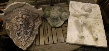 A plaster cherub plaque, a reconstituted stone bracket and a ram's head wall mask, largest 56 x