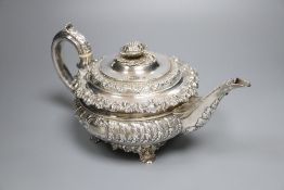 A George IV embossed silver squat circular teapot by Emes & Barnard, London, 1822, height 14cm,