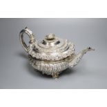 A George IV embossed silver squat circular teapot by Emes & Barnard, London, 1822, height 14cm,