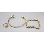 A yellow metal bangle, a yellow metal small chain bracelet, 15cm and a yellow metal gem set '