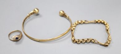 A yellow metal bangle, a yellow metal small chain bracelet, 15cm and a yellow metal gem set '