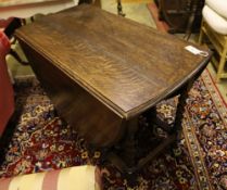 A 1920's oak twist leg gateleg table, width 102cm, depth 54cm, height 72cm