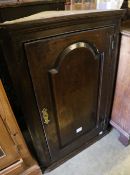 A late 18th century oak hanging corner cupboard, width 66cm depth 31cm height 95cm