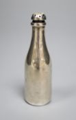 An Edwardian novelty silver pepperette, modelled as a Champagne bottle, Saunders & Shepherd,