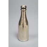 An Edwardian novelty silver pepperette, modelled as a Champagne bottle, Saunders & Shepherd,