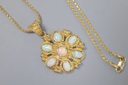 A Turkish 585 and white opal flowerhead pendant on chain by Istor, the pendant set with seven