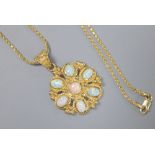 A Turkish 585 and white opal flowerhead pendant on chain by Istor, the pendant set with seven