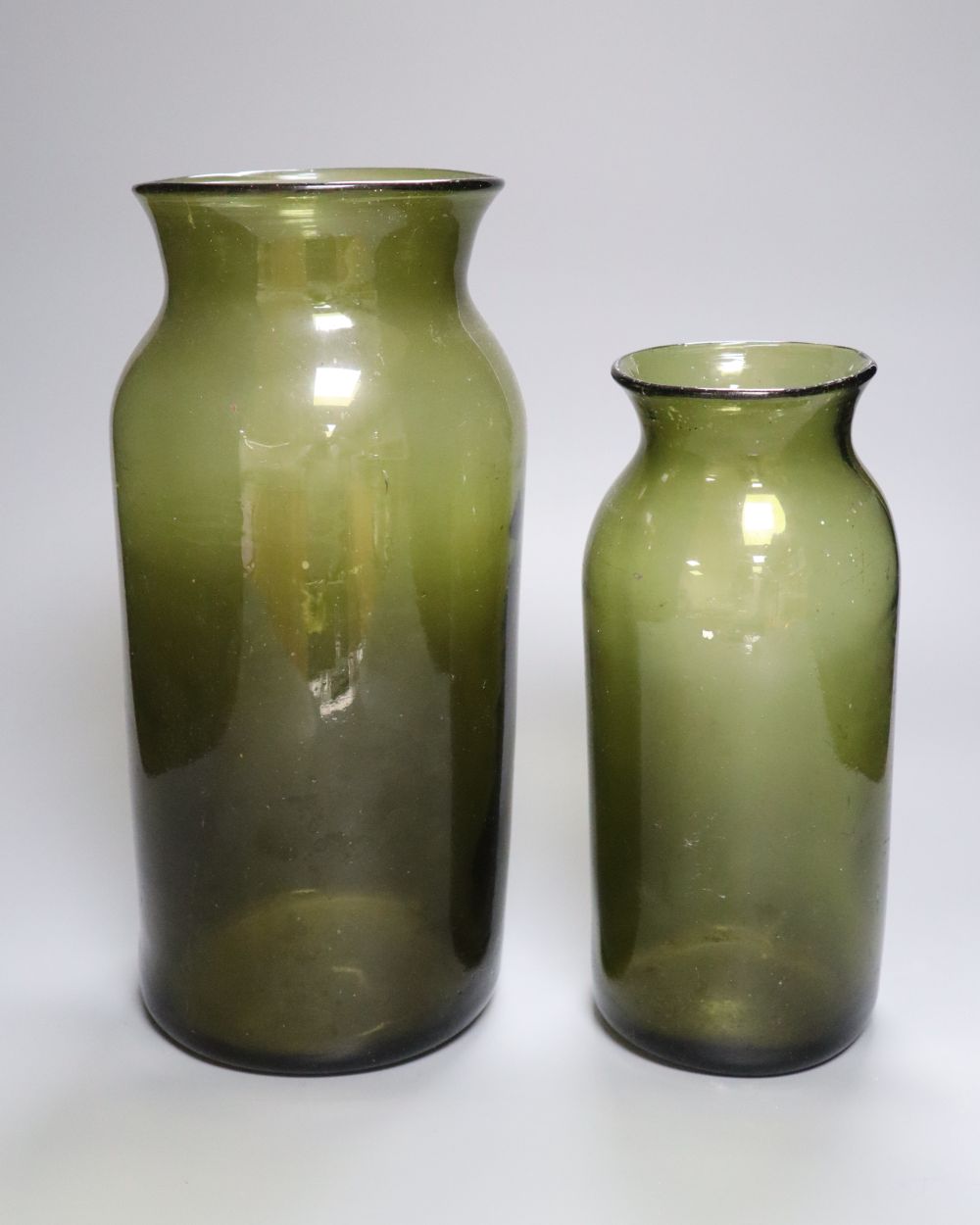 Two 19th century French green glass storage jars, 31.5 and 25.5cmCONDITION: Provenance - Andrew