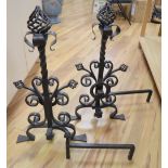 A pair of large Arts & Crafts wrought iron fire dogs, height 72cm